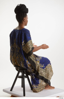  Dina Moses  1 dressed sitting traditional decora long african dress whole body 0012.jpg